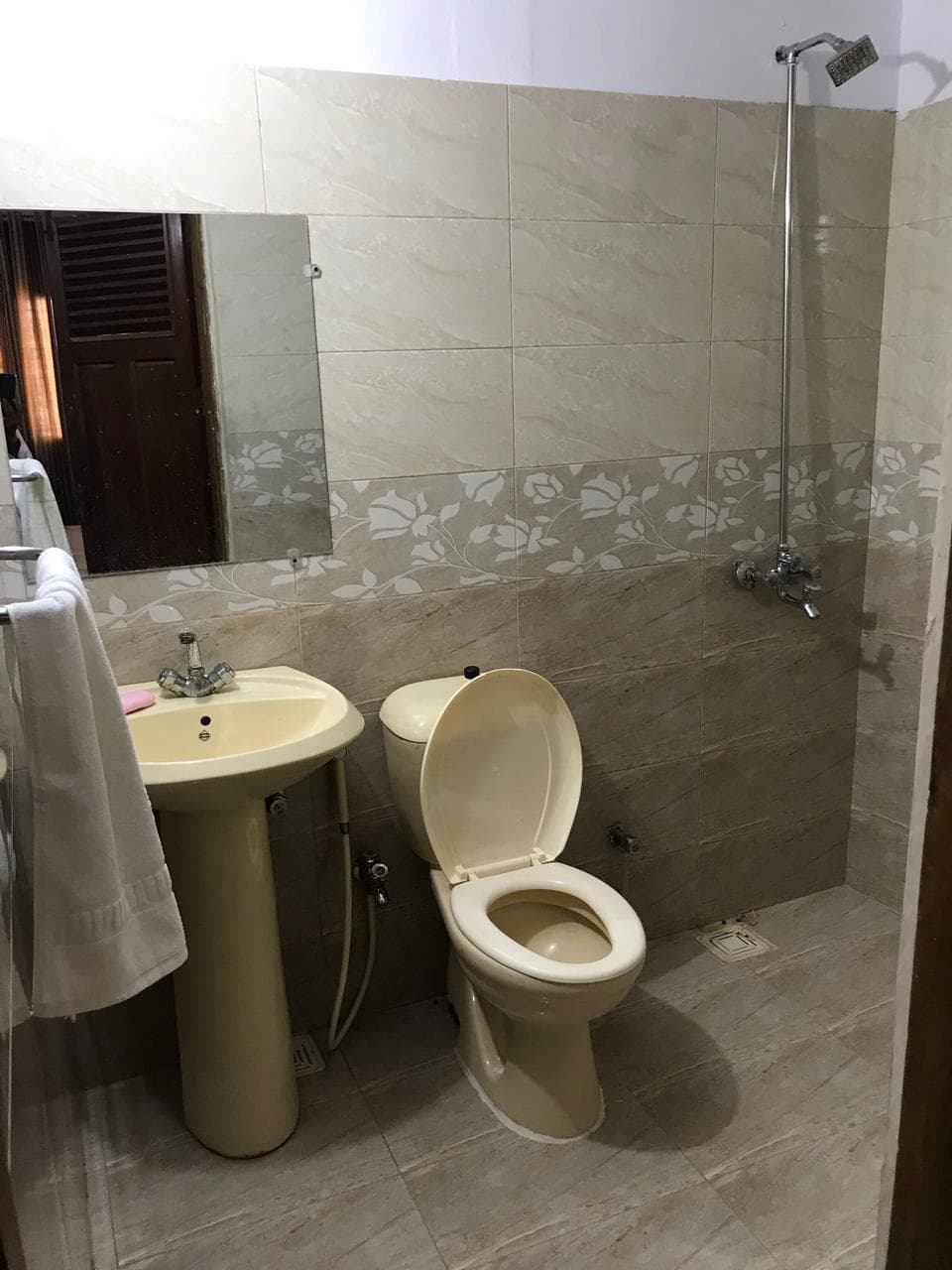 Bathroom with shower and sink