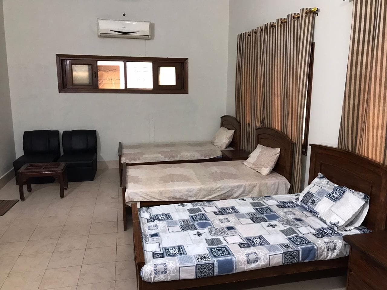 Shared hostel room with seating area